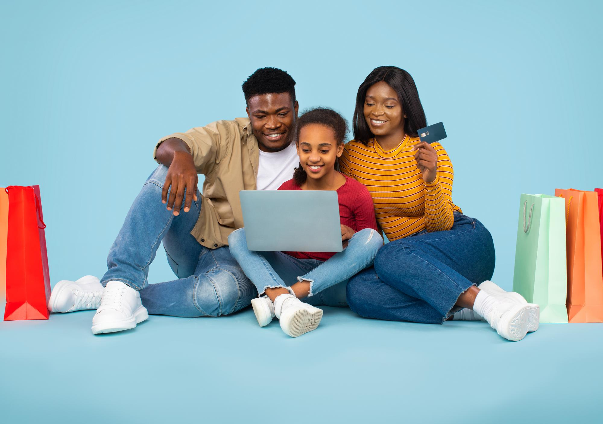 Happy family shopping online together at home